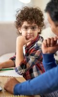 cute-latin-school-boy-looking-thoughtful-talking-2021-12-27-21-39-50-utc-min.jpg